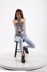 MOLLY SITTING POSE WITH GUN